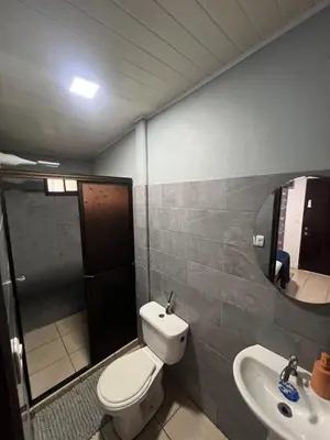 a bathroom with a toilet and a sink at Casa Lapas in Guayabal