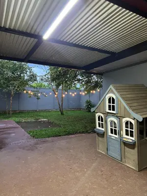 a toy dog house sitting under a garage at Casa Lapas in Guayabal