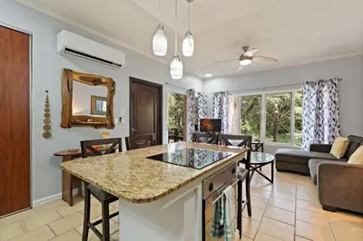 a kitchen and living room with a living room at Tropical Balcony 10-minute walk to Adventures in Santa Cruz