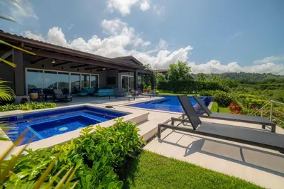 an image of a villa with a swimming pool at Casa Blue Sail 6 bdr Ocean View in Herradura
