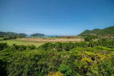 a view of the golf course from the hill at Casa Blue Sail 6 bdr Ocean View in Herradura