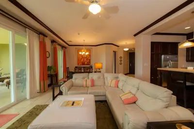 a living room with a couch and a table at Vista Bahia 1G - 3bed 3 bath Ocean View in Herradura