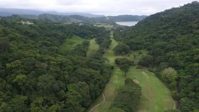 an overhead view of a golf course in a forest at Vista Bahia 3D - 3bdr 3bath plunge pool in Herradura