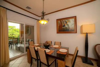 a dining room with a table and chairs at Veranda 2B - 3 bdr 3 bath in La Mona