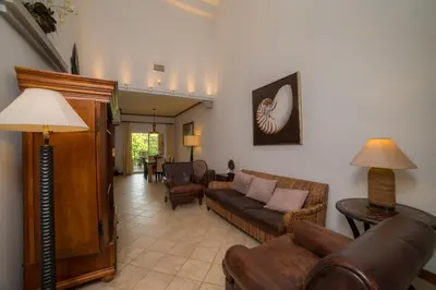 a living room with a couch and chairs at Veranda 2B - 3 bdr 3 bath in La Mona