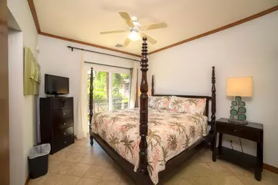 a bedroom with a bed and a ceiling fan at Veranda 2B - 3 bdr 3 bath in La Mona