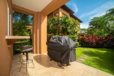 a trash can sitting outside of a house at Veranda 3G 2 bedr 2 bath in La Mona