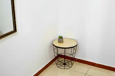 a small stool with a plant sitting on top of it at Comfort Near the Sea Valgreenplace Herradura in Herradura