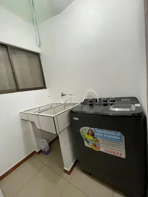 a small kitchen with a sink and a stove at Comfort Near the Sea Valgreenplace Herradura in Herradura