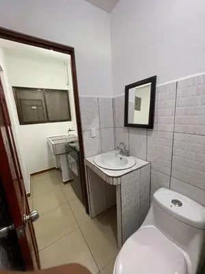 a bathroom with a toilet and a sink at Comfort Near the Sea Valgreenplace Herradura in Herradura