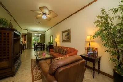 a living room with a couch and a tv at Veranda 4F - 2 bdr -2 bath in La Mona