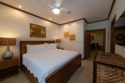 a bedroom with a large bed and a table at Veranda 5H - 1 Bedr 1 Bath in La Mona