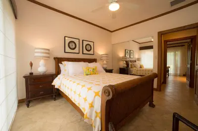 a bedroom with a bed and a dresser and a lamp at Veranda 8F - 2 bdr 2 bath - Condo in La Mona