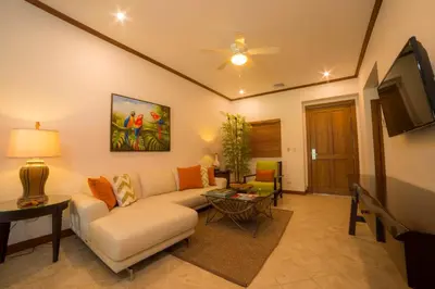 a living room with a couch and a tv at Veranda 8F - 2 bdr 2 bath - Condo in La Mona