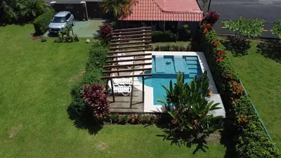 an aerial view of a house with a swimming pool at 2 Tiny Houses Private Pool Volcano View 6 people in Fortuna