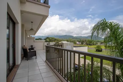 a balcony with a view of the mountains at Jaco Bay 4303 in Jacó
