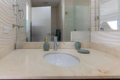 a bathroom with a sink and a shower at Jaco Bay 4303 in Jacó