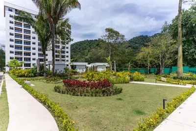 a garden in front of a building at Selva Coral 0701 in Jacó
