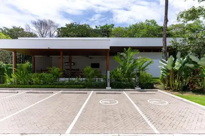 a parking lot in front of a building at Selva Coral 0701 in Jacó
