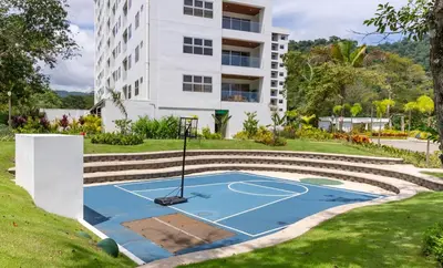 a basketball court in front of a building at Selva Coral 0701 in Jacó