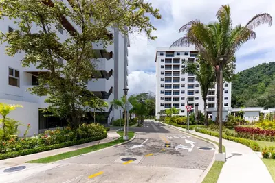 an empty street in front of a building at Selva Coral 0701 in Jacó