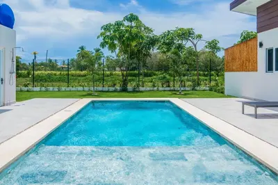 a swimming pool in the backyard of a house at Entire Property - Triskele Retreat in Esterillos