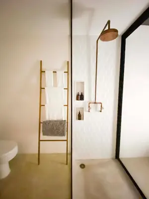 a bathroom with a ladder next to a toilet at Nalu Nosara Pool Villa Mar in Nosara