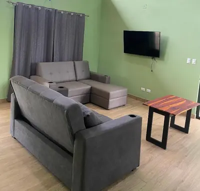 a living room with a couch and a table at Casa Ema in La Abuela