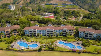 an aerial view of a resort with two swimming pools at Del Mar 1G 3 bdr - 2bth ocean view in Herradura