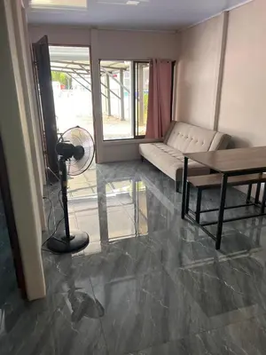 a living room with a couch and a table at Paquera apartment in Paquera