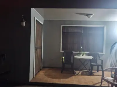 a room with a table and chairs and a window at Surf House Aparment in Coco