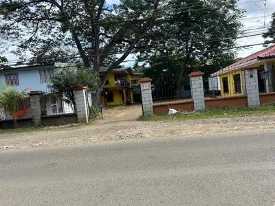 a row of houses on the side of a street at Surf House Aparment in Coco