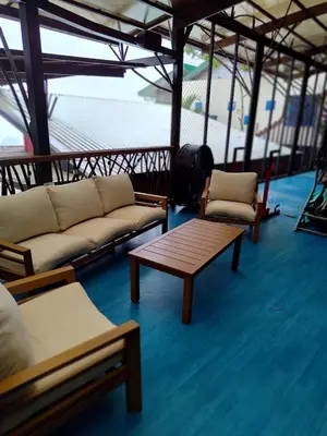 a living room with couches and a table on a boat at Villa Jardin in Quepos