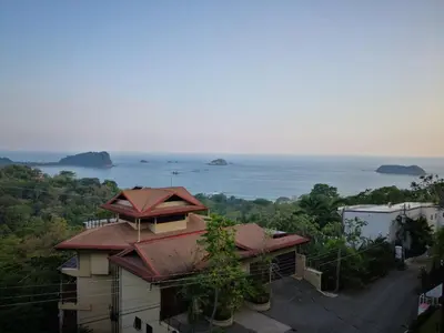 a house with a view of the ocean at Villa Jardin in Quepos