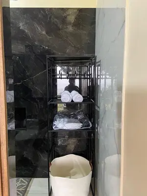 a glass shelf with a chair in a room at Casita El Perezoso in San Rafael