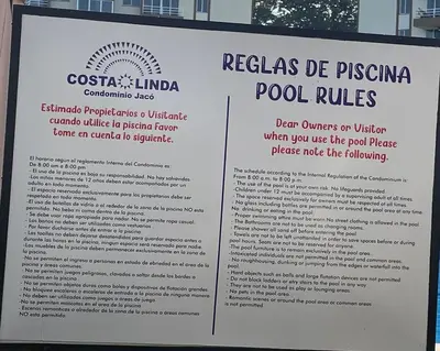 a sign for a pool rules at CL127 Modern Penthouse in Jacó