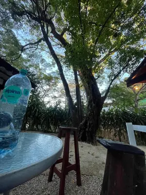 a bottle of water sitting on top of a table at Green Point Nature Retreat in Nosara