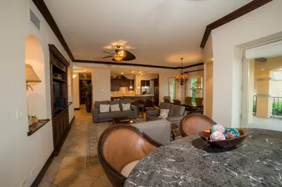 a kitchen and living room with a table and chairs at Marbella 3D 3 BR Ocean View in La Mona