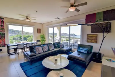 a living room with a couch and a table at Miramar 5B Family 3 bedr 3 bath in La Mona