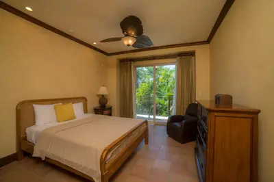 a bedroom with a bed and a ceiling fan at Montebello 1C - 3 bdr 3 bath Ocean view in La Mona