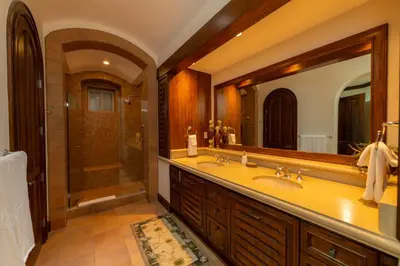 a bathroom with two sinks and a shower at Montebello 1E 3 bed 3 bath ocean view in La Mona