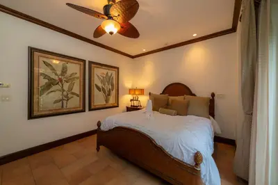 a bedroom with a bed and a ceiling fan at Montebello 1E 3 bed 3 bath ocean view in La Mona