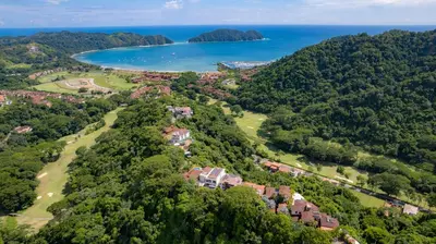 an aerial view of a house on a hill next to the ocean at Montebello 1E 3 bed 3 bath ocean view in La Mona