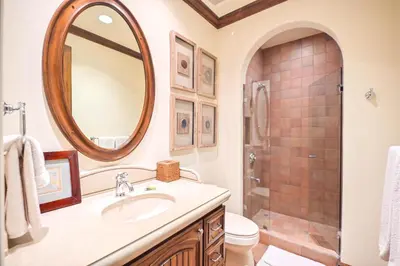 a bathroom with a sink and a shower with a mirror at Montebello 2C - 3 bdr 3 bath Ocean View in La Mona