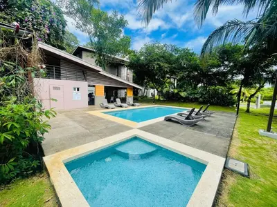 a swimming pool in the backyard of a house at Beach Apartment with Pool and Lake - Playa Hermosa in Muñeco