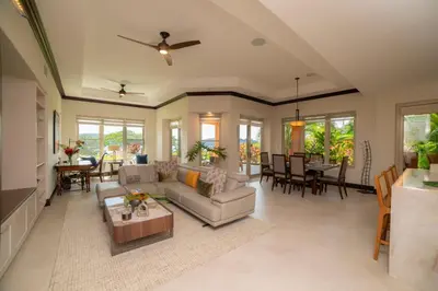 a living room with a couch and a table at Terrazas 1A - 3 bedroom - seven day minimum in La Mona