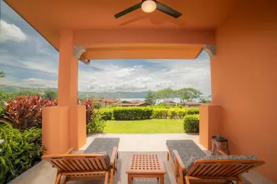 a patio with two chairs and a ceiling fan at Terrazas 1A - 3 bedroom - seven day minimum in La Mona