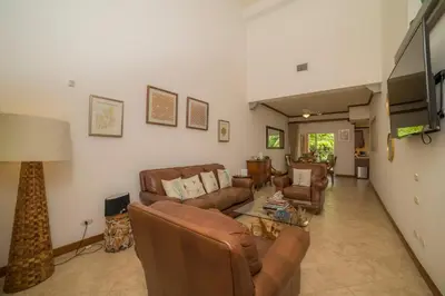 a living room with couches and a table at Veranda 1C - 3 bdr 3 bath in La Mona
