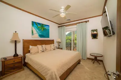 a bedroom with a bed and a ceiling fan at Veranda 1C - 3 bdr 3 bath in La Mona