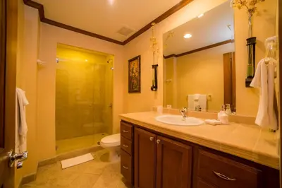 a bathroom with a sink and a shower and a toilet at Veranda 1E 3bdr 3 bath in La Mona
